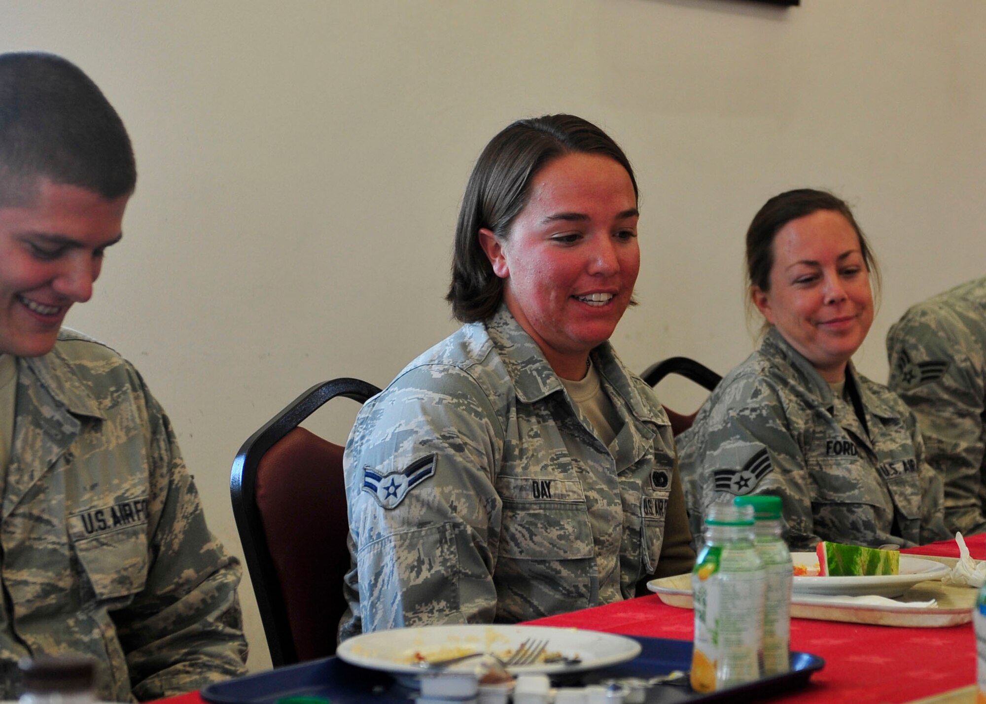 Airmen from the 379th Air Expeditionary Wing share deployment insights with U.S. Air Force Brig. Gen. Darren Hartford, 379th AEW commander, at Al Udeid Air Base, Qatar, July 16, 2014. Each Airman shared one positive trait of being at Al Udeid and one issue that could be improved. (U.S. Air Force photo by Senior Airman Colin Cates)