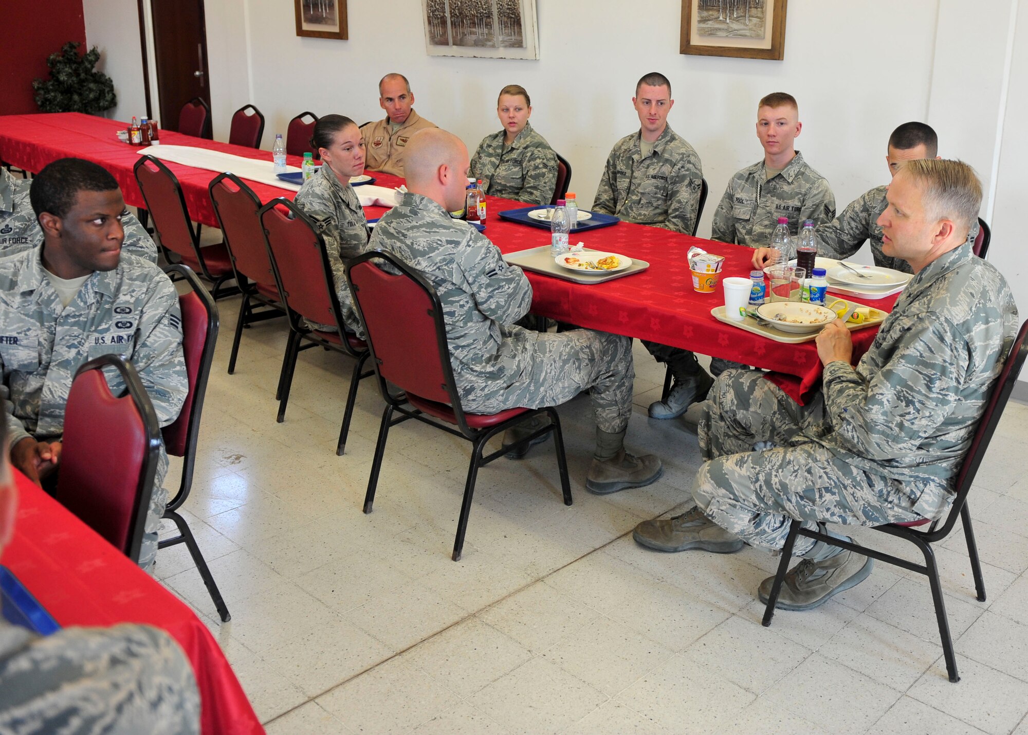 Airmen from the 379th AEW at Al Udeid Air Base, Qatar have breakfast with U.S. Air Force Brig. Gen. Darren Hartford, 379th Air Expeditionary Wing commander, July 16, 2014. Hartford answered various questions about quality of life from the group and shared his insights on leadership and where the 379th AEW is headed. (U.S. Air Force photo by Senior Airman Colin Cates)