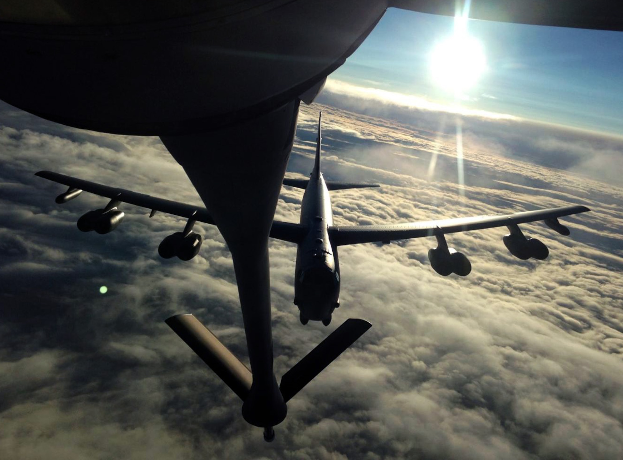 A B-52 Stratofortress closes in on the refueling boom of a KC-135 Stratotanker assigned to McConnell Air Force Base, Kan., during an air refueling exercise, July 17, 2014. The KC-135 was operated by an aircrew made up of Air Force Reservists from the 18th Air Refueling Squadron, 931st Air Refueling Group, at McConnell. Air refueling exercises are conducted regularly in order for aircrews to maintain proficiency. (U.S. Air Force photo by Senior Master Sgt. Ray Lewis)