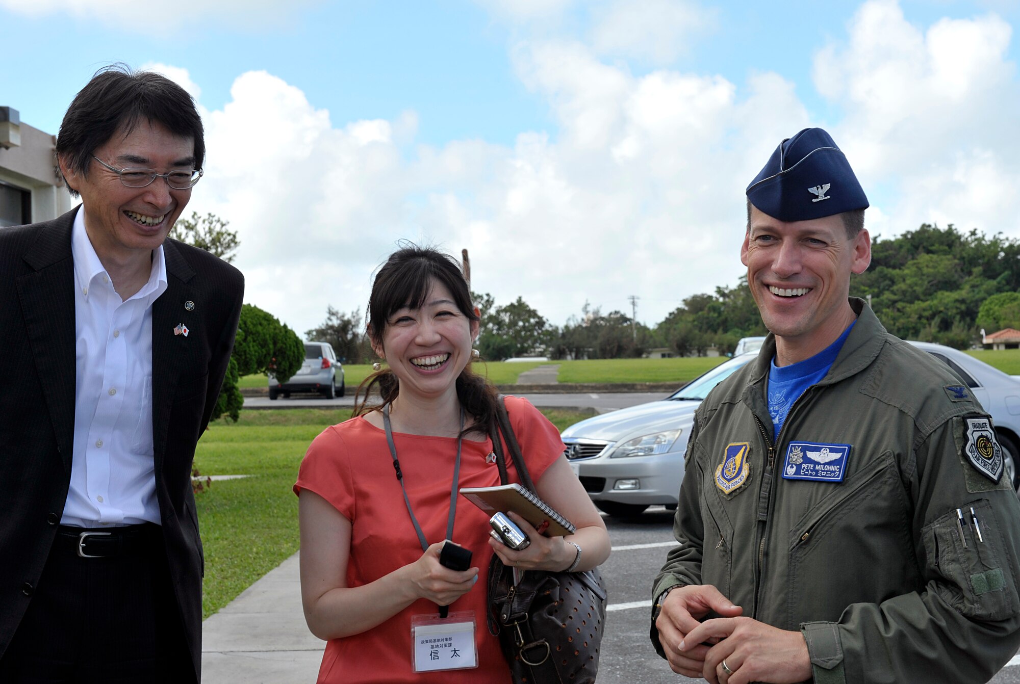Masao Kurokawa (left), Kanagawa prefectural government vice governor, Shizuka Shinta (middle), KPG U.S. Military facilities relations division senior staff member, and U.S. Air Force Col. Peter Milohnic (right), 18th Operations Group commander, enjoy a conversation during their visit on Kadena Air Base, Japan, July 18, 2014. The purpose of the visit was to learn about the roles and current state of U.S. facilities in Okinawa. (U.S. Air Force photo by Naoto Anazawa/Released)