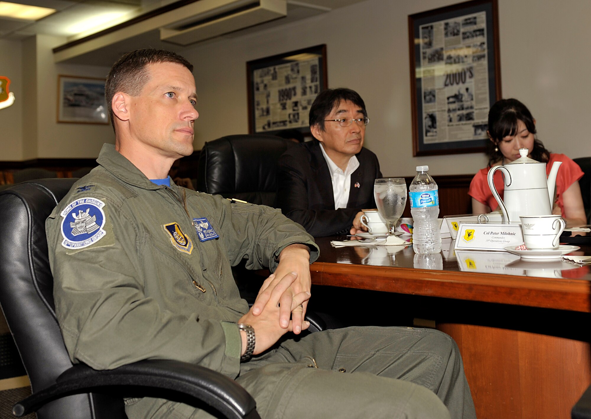 U.S. Air Force Col. Peter Milohnic, 18th Operations Group commander, and Masao Kurokawa, Kanagawa prefectural government vice governor, attend a mission briefing during Kurokawa's visit to Kadena Air Base, Japan, July 18, 2014. The purpose of the visit was to learn about the roles and current state of U.S. facilities in Okinawa. Kanagawa prefecture has been working on collaborative efforts with the U.S. Army and Navy, organizing a mutual aid system in time of disasters. (U.S. Air Force photo by Naoto Anazawa/Released)