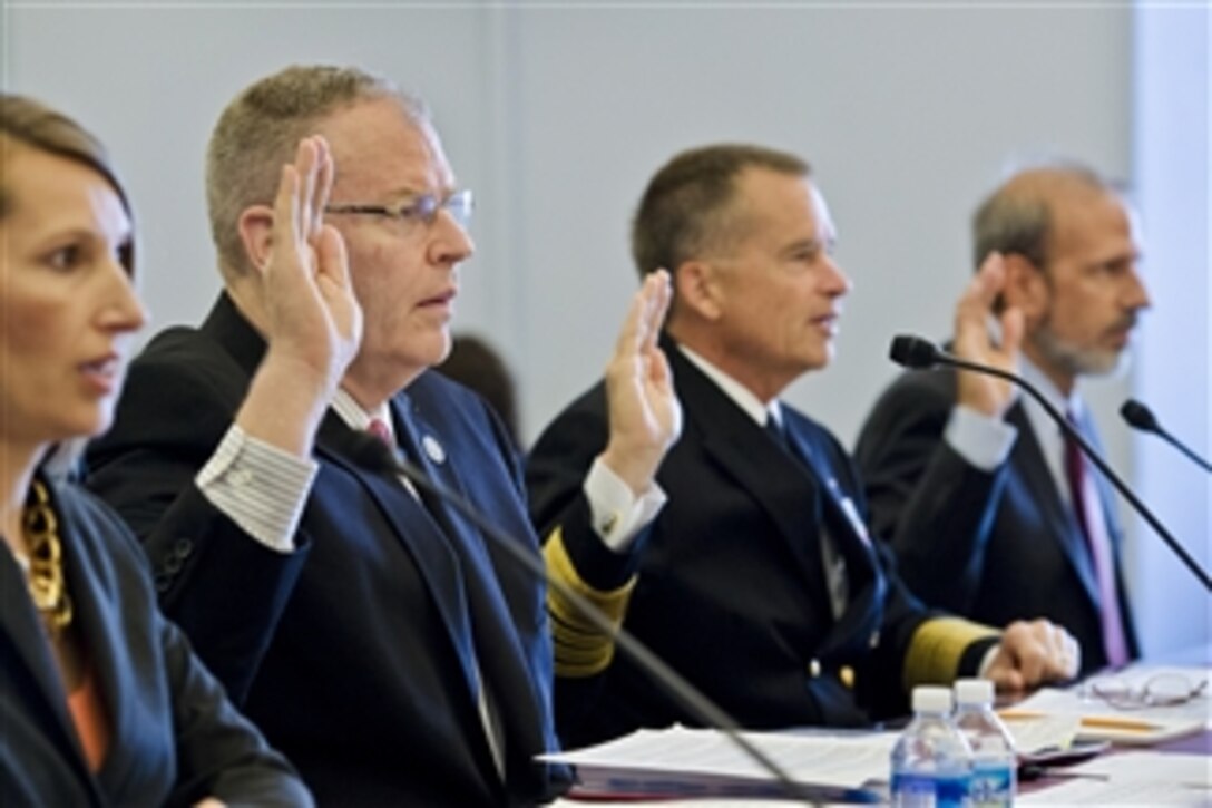 Deputy Defense Secretary Bob Work, left, Navy Adm. James A. Winnefeld Jr., vice chairman of the Joint Chiefs of Staff, and Michael J. McCord, the Defense Department's comptroller, testify on the fiscal year 2015 budget request for overseas contingency operations before the House Budget Committee in Washington, D.C., July 17, 2014.