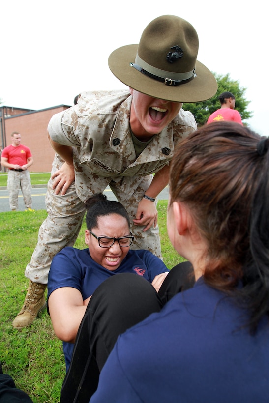 Gunnery Sgt. Mary Grimaldi, a drill instructor from Marine Corps Recruit Depot Parris Island, S.C., motivates a Female Poolee, a women currently enrolled in the Marine Corps’ Delayed Entry Program, to count louder on Westover Air Reserve Base, July 19. The Poolees spent the day conducting an Initial Strength Test and learning drill. (Official Marine Corps Photo by Sgt. Richard Blumenstein)