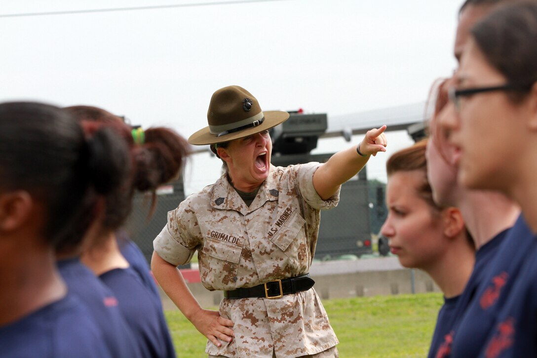 Gunnery Sgt. Mary Grimaldi, a drill instructor from Marine Corps Recruit Depot Parris Island, S.C., teaches Marine Corps Drill to Female Poolees, women currently enrolled in the Marine Corps’ Delayed Entry Program, on Westover Air Reserve Base, July 19. The Poolees spent the day conducting an Initial Strength Test and learning drill. (Official Marine Corps Photo by Sgt. Richard Blumenstein)