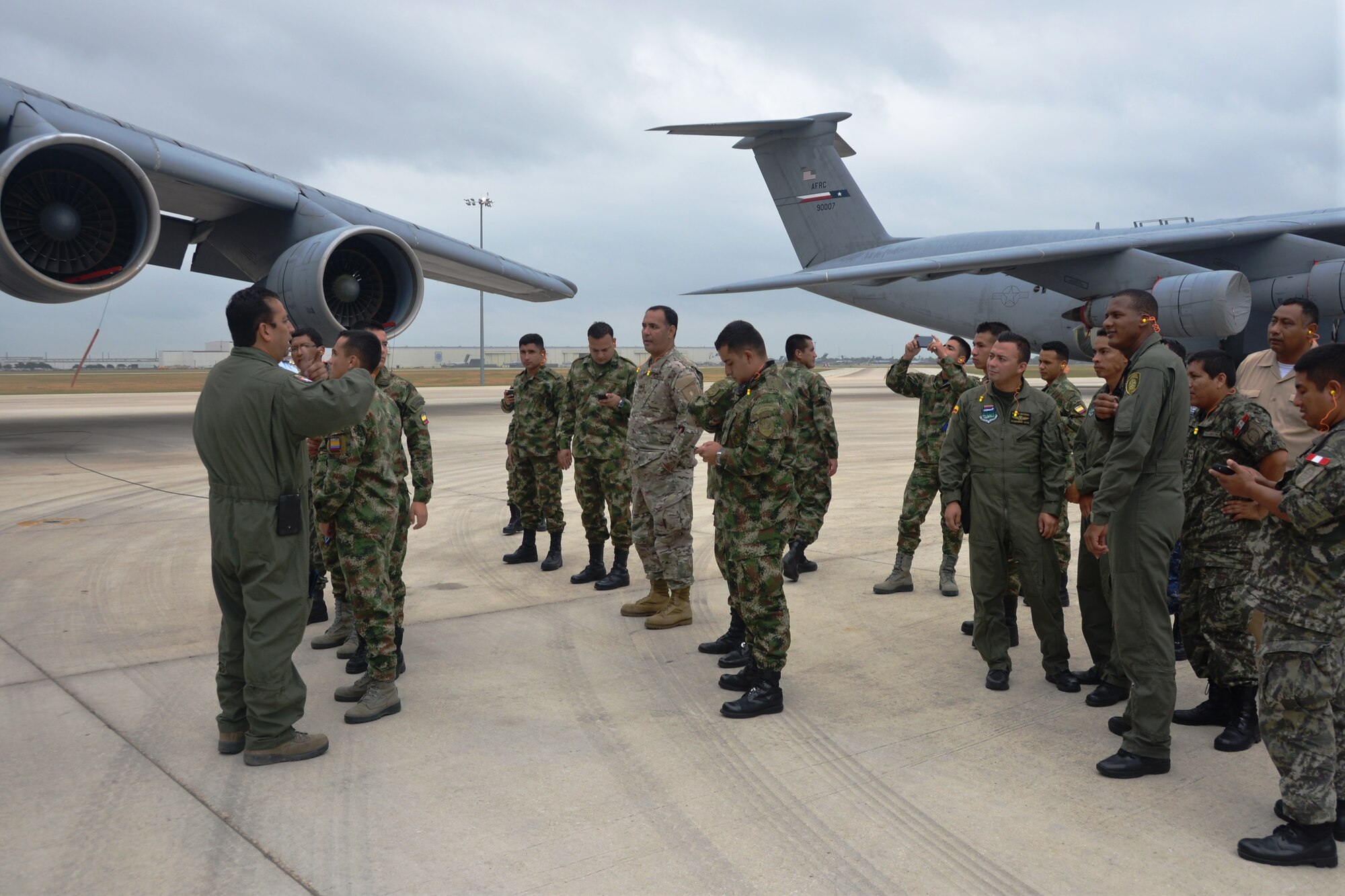 Students from the Inter-American Air Forces Academy, Joint Base San Antonio -Lackland, Texas stand on the flight line just prior to boarding one of the 443rd Airlift Wing’s C-5A Galaxies. The students had an opportunity to receive a tour of a C-5A static, the wing's propulsion branch, the metals technology and structural repair shops, and how the “Alamo Wing” maintainer’s keep their C5As mission ready, July 17, 2014. The tour was hosted by the 433rd Airlift Wing, JBSA-Lackland, Texas. (U.S. Air Force photo by Minnie Jones)