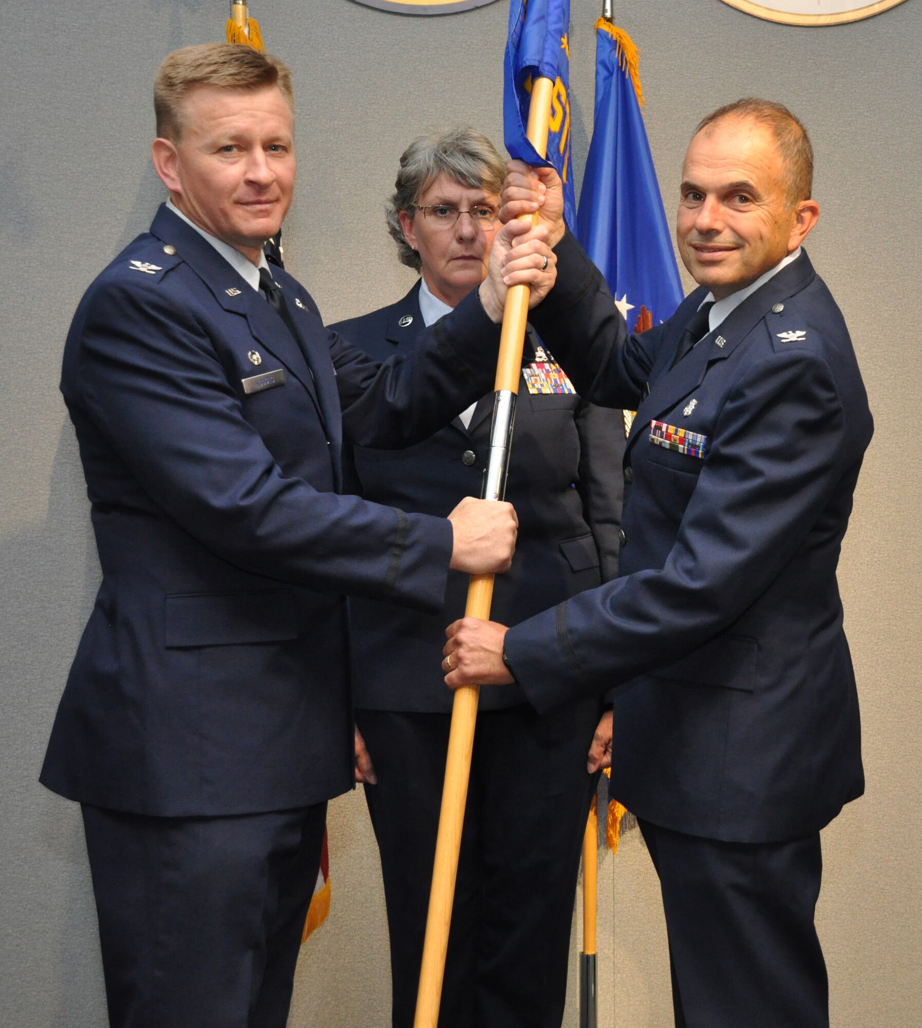 Colonel Oba Vincent (right) receives the guidon from Col. Scheid Hodges, commander, 459th Air Refueling Wing, and assumes command of the 459th Aeromedical Staging Squadron, during an Assumption of Command ceremony at Joint Base Andrews, Maryland, July 19, 2014. Vincent comes to the wing from Kirtland Air Force Base, New Mexico, where he served as a medical inspector and team leader with the Air Force Inspection Agency and led health services inspections at Guard and Reserve medical Squadrons across the country.  (U.S. Air Force Photo/Maj. Tim Smith)