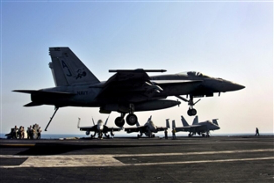 An F/A-18E Super Hornet  lands on the flight deck of the aircraft carrier USS George H.W. Bush in the Arabian Gulf, July 16, 2014. The carrier is supporting maritime security operations and theater security cooperation efforts in the U.S. 5th Fleet area of responsibility. The Hornet is assigned to Strike Fighter Squadron 31.