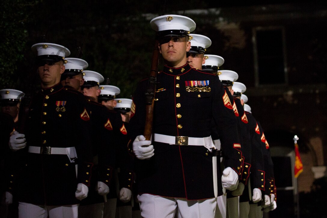 Ceremonial marchers from Marine Barracks Washington, perform during a Friday Evening Parade at the Barracks, July 18, 2014.