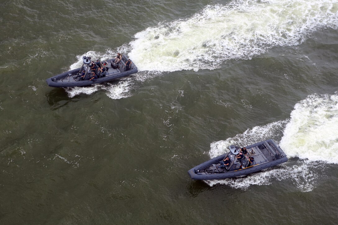 Two rigid-hulled inflatable boats, or RHIBs, from the Navy’s 8th Amphibious Squadron and Marines from the 24th Marine Expeditionary Unit’s Maritime Raid Force, Force Reconnaissance Company, 2nd Reconnaissance Battalion, stalk a simulated vessel of interest during a Visit, Board, Search, and Seizure exercise, July 15, 2014.  The exercise, held at Joint Base Langley-Eustis, Va., is part of Realistic Urban Training for the purpose of Maritime Interdiction Operations.  RUT is the first major pre-deployment training exercise for the 24th MEU in preparation for their deployment later this year. (U.S. Marine Corps photo by Cpl. Devin Nichols)