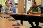 Maj. Gen Timothy Reisch, adjutant general of the South Dakota National Guard, meets with Col. Adolf Jardim, deputy commander of the Suriname Armed Forces, during the Reserve Forces Subject Matter Expert Exchange at Camp Rapid, S.D., July 11, 2014. 
