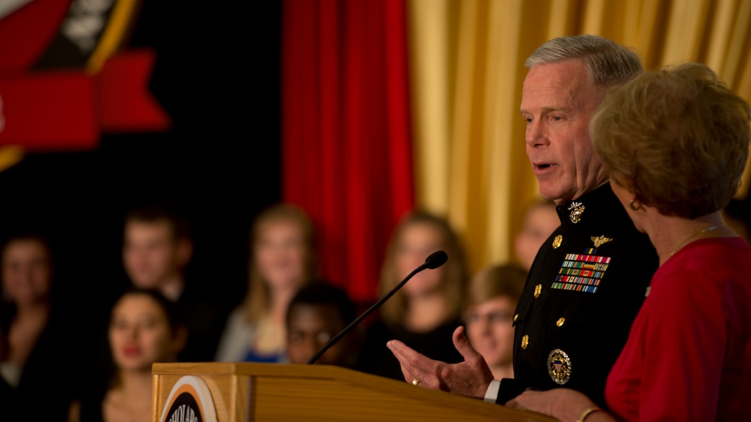 Commandant of the Marine Corps Gen. James F. Amos and his wife Bonnie address scholarship recipients during the Marine Corps Scholarship Foundation announcement ceremony hosted at the Ronald Reagan building in Washington, July 15, 2014. Since 1962 the Marine Corps Scholarship Foundation has awarded more than 30,00 scholarships valued at more than 90 million dollars.
