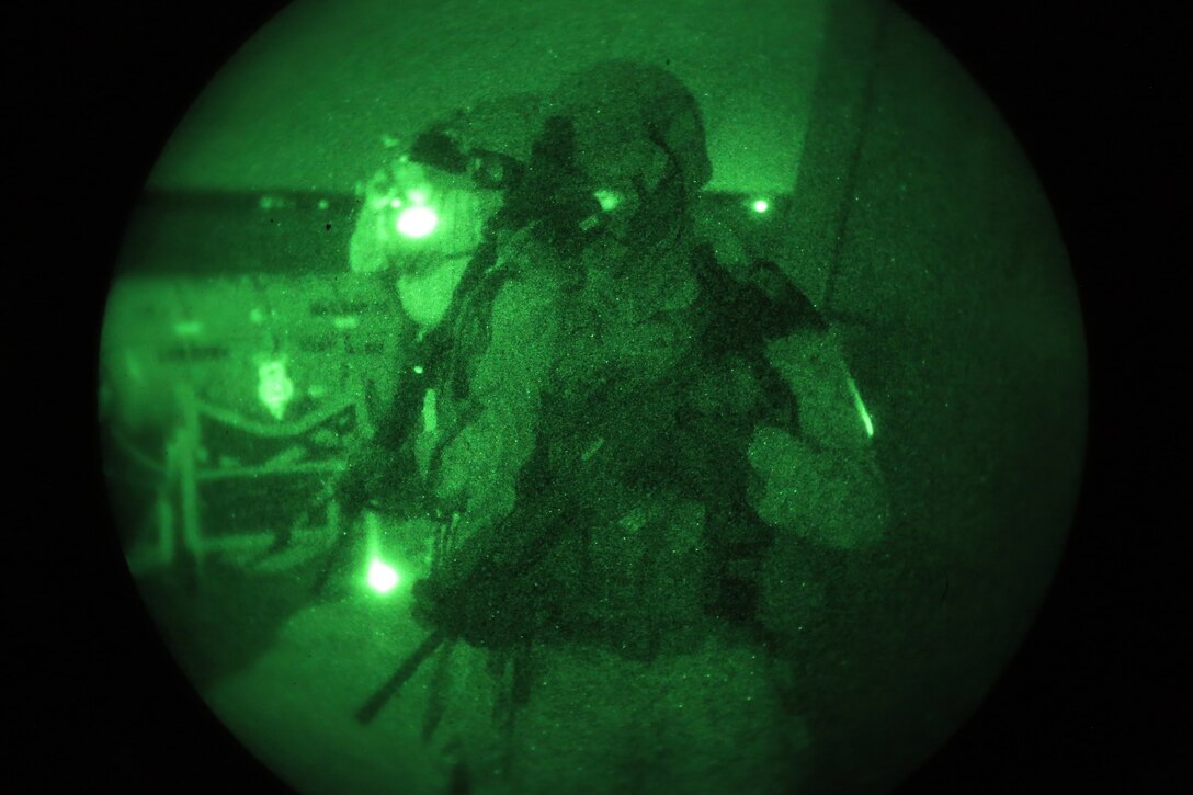 A Marine with the 24th Marine Expeditionary Unit’s Maritime Raid Force conducts security during a nighttime Visit, Board, Search, and Seizure exercise at Joint Base Langley-Eustis, Va., July 17, 2014. The exercise was part of Realistic Urban Training, the 24th MEU’s first major pre-deployment training exercise in preparation for their deployment at the end of the year. The MRF is a contingent of Marines from Force Reconnaissance Company, 2nd Reconnaissance Battalion. (U.S. Marine Corps photo by Cpl. Devin Nichols)