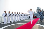 DALIAN, China (July 17, 2014) - Chief of Naval Operations (CNO) Adm. Jonathan Greenert departs the People's Liberation Army Navy (PLAN) ship Datong FFG 580 with the ship's Commanding Officer Lt. Cmdr. Hao He after touring the ship and transiting to Lushun Naval Base. Greenert's visit to the PLAN came at the mutual request of U.S. and Chinese leadership to strengthen existing military relations between the two navies through additional military exercises, port visits and exchanges to advance maritime cooperative efforts in the Asia-Pacific. (U.S. Navy photo by Chief Mass Communication Specialist Peter D. Lawlor) 140717-N-WL435-552 
