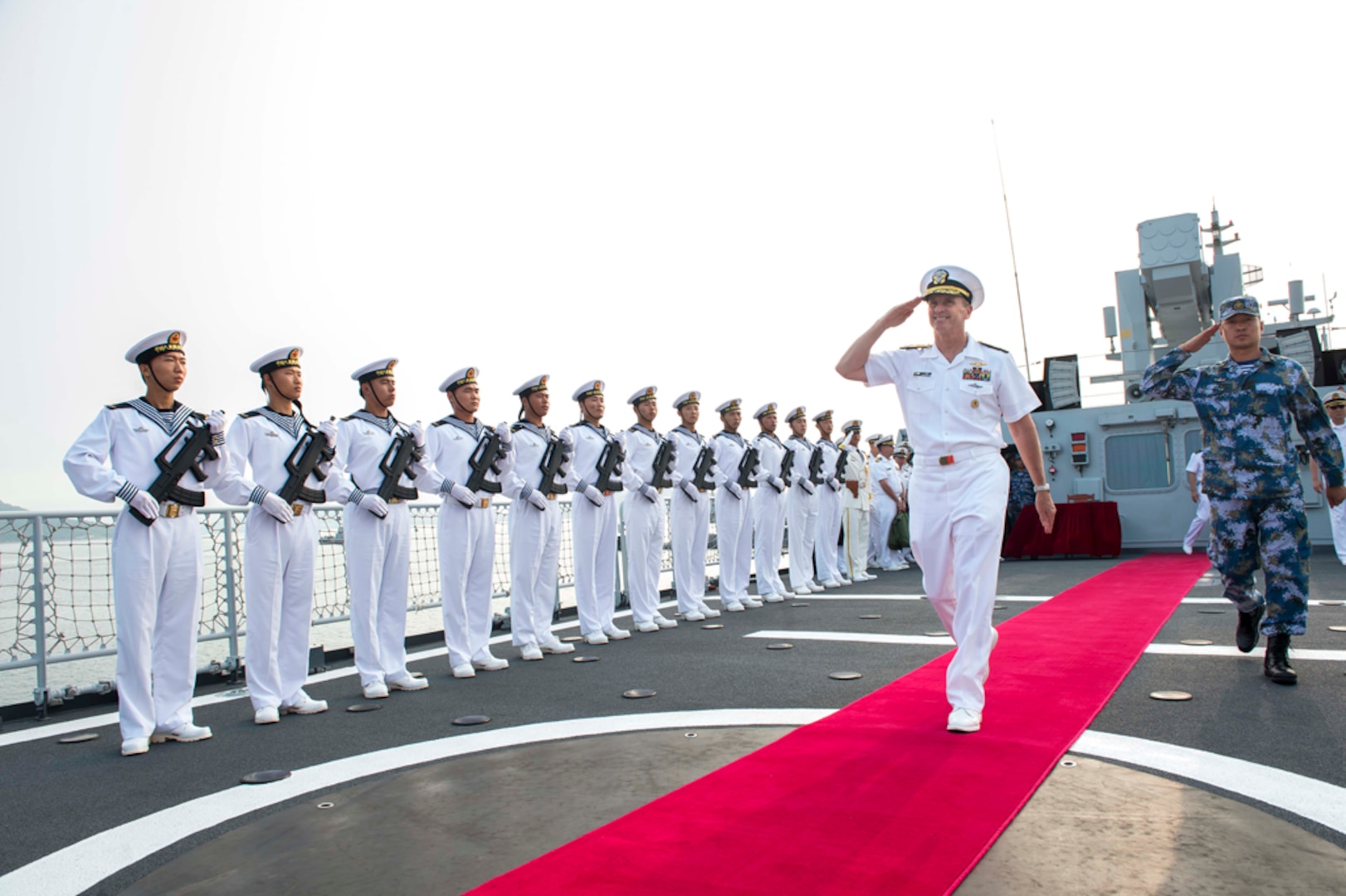 DALIAN, China (July 17, 2014) - Chief of Naval Operations (CNO) Adm. Jonathan Greenert departs the People's Liberation Army Navy (PLAN) ship Datong FFG 580 with the ship's Commanding Officer Lt. Cmdr. Hao He after touring the ship and transiting to Lushun Naval Base. Greenert's visit to the PLAN came at the mutual request of U.S. and Chinese leadership to strengthen existing military relations between the two navies through additional military exercises, port visits and exchanges to advance maritime cooperative efforts in the Asia-Pacific. (U.S. Navy photo by Chief Mass Communication Specialist Peter D. Lawlor) 140717-N-WL435-552 
