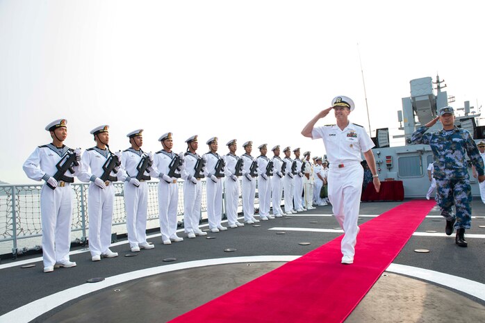 DALIAN, China (July 17, 2014) - Chief of Naval Operations (CNO) Adm. Jonathan Greenert departs the People's Liberation Army Navy (PLAN) ship Datong FFG 580 with the ship's Commanding Officer Lt. Cmdr. Hao He after touring the ship and transiting to Lushun Naval Base. Greenert's visit to the PLAN came at the mutual request of U.S. and Chinese leadership to strengthen existing military relations between the two navies through additional military exercises, port visits and exchanges to advance maritime cooperative efforts in the Asia-Pacific. (U.S. Navy photo by Chief Mass Communication Specialist Peter D. Lawlor) 140717-N-WL435-552 
