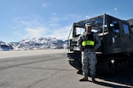 Army National Guard 1st Lt. Edward Baon, the 95th Civil Support Team medical operations officer and exercise Operation Red Snow director, leans on a Bandvagn, an all-terrain vehicle, at the Marine Corps Mountain Warfare Training Center about 20 miles northwest of Bridgeport, Calif. Nearly 100 California Air and Army National Guard members conducted cold weather training here Feb. 13-17, 2012 as part of Operation Red Snow.