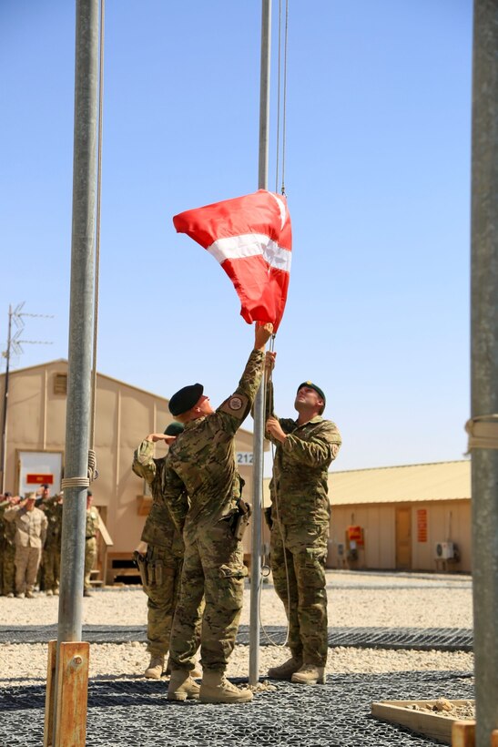 Danish soldiers, part of the Danish Contingent International Security Assistance Force 17 (DANCON
ISAF-17), participate in the Flag Lowering Ceremony aboard Camp Leatherneck, Helmand province, Afghanistan, July 21, 2014. The lowering of the Danish flag over Camp Leatherneck formally concludes the county's participation in RC(SW).
(Official U. S. Marine Corps photo by Sgt. Dustin D. March/Released)