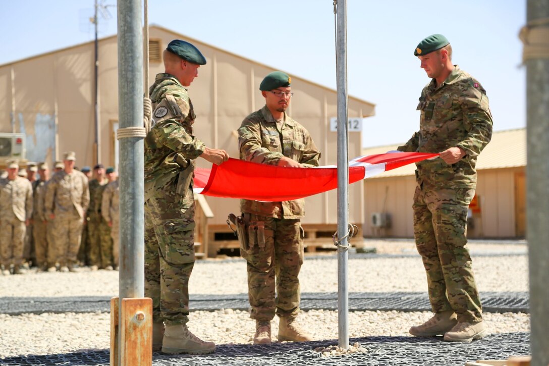 Danish soldiers, part of the Danish Contingent International Security Assistance Force 17 (DANCON
ISAF-17), participate in the Flag Lowering Ceremony aboard Camp Leatherneck, Helmand province, Afghanistan, July 21, 2014. The lowering of the Danish flag over Camp Leatherneck formally concludes the county's participation in RC(SW).
(Official U. S. Marine Corps photo by Sgt. Dustin D. March/Released)