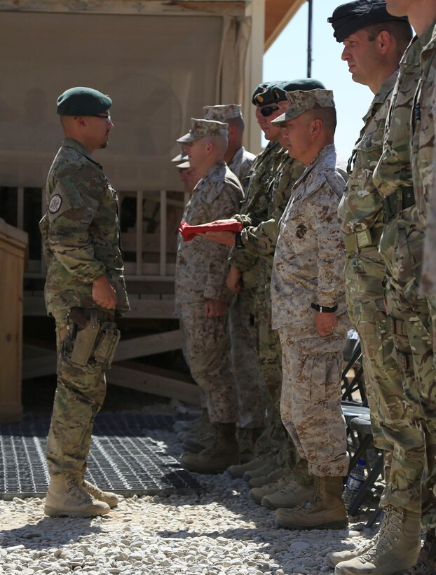 Danish soldiers, part of the Danish Contingent International Security Assistance Force 17 (DANCON
ISAF-17), participate in the Flag Lowering Ceremony aboard Camp Leatherneck, Helmand province, Afghanistan, July 21, 2014. The lowering of the Danish flag over Camp Leatherneck formally concludes the county's participation in RC(SW).
(Official U. S. Marine Corps photo by Sgt. Dustin D. March/Released)