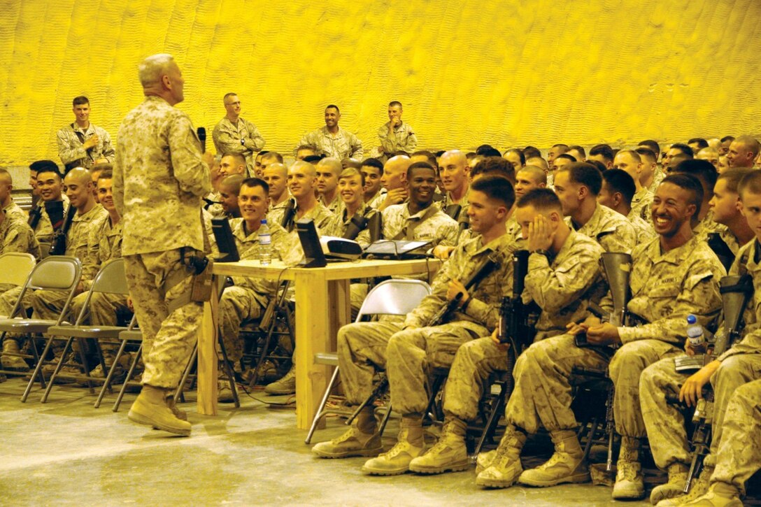 Assistant Commandant of the Marine Corps Gen. John M. Paxton Jr. speaks to Marines and sailors during a town hall meeting aboard Camp Leatherneck, Helmand province, Afghanistan, July 18, 2014. During the meeting, Gen. Paxton discussed the restructuring of the Corps, how Marines will reset into peacetime as a crisis response force, as well as the integration of women into ground combat jobs.