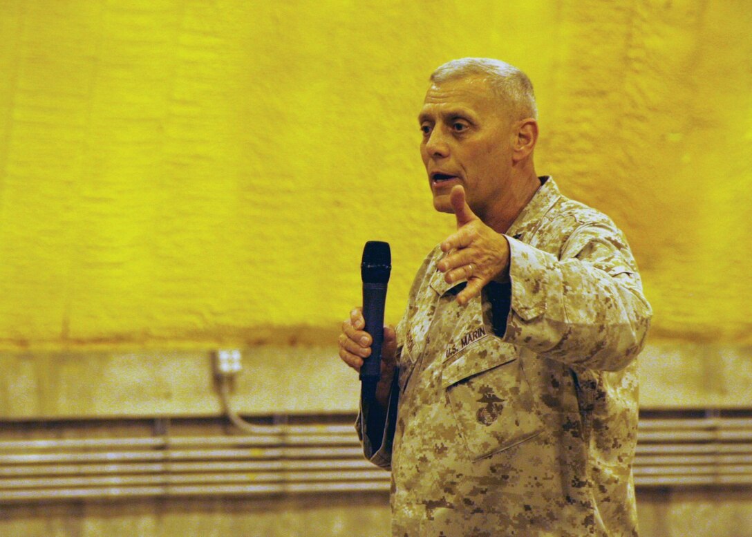Assistant Commandant of the Marine Corps Gen. John M. Paxton Jr. speaks to Marines and sailors during a town hall meeting aboard Camp Leatherneck, Helmand province, Afghanistan, July 18, 2014. During the meeting, Gen. Paxton discussed the restructuring of the Corps, how Marines will reset into peacetime as a crisis response force, as well as the integration of women into ground combat jobs.