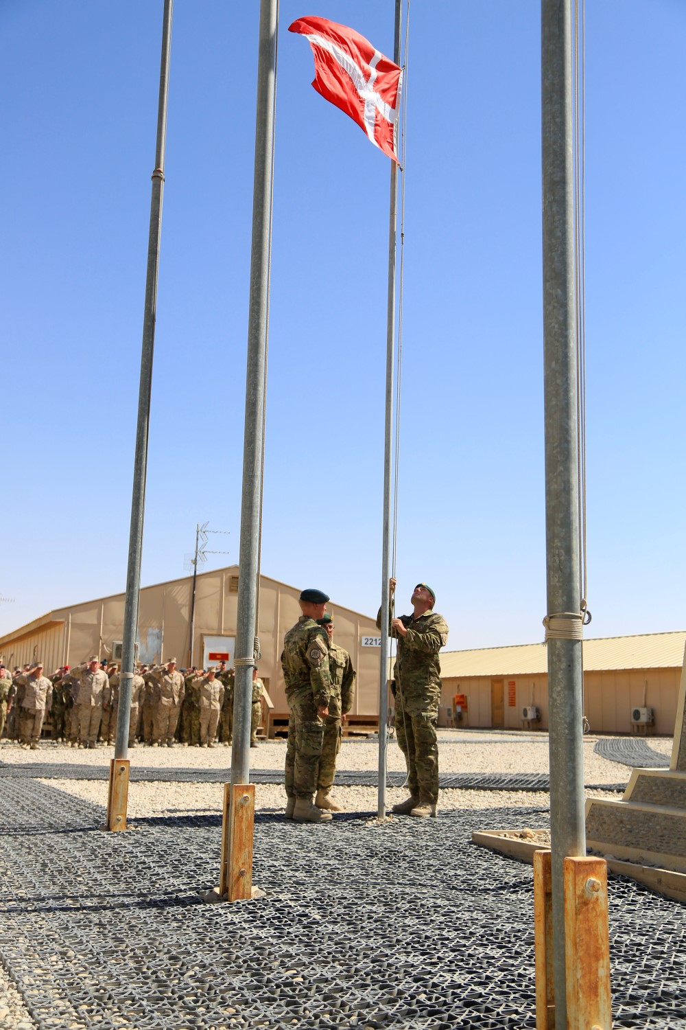 Danish soldiers, part of the Danish Contingent International Security Assistance Force 17 (DANCON
ISAF-17), participate in the Flag Lowering Ceremony aboard Camp Leatherneck, Helmand province, Afghanistan, July 21, 2014. The lowering of the Danish flag over Camp Leatherneck formally concludes the county's participation in RC(SW).
(Official U. S. Marine Corps photo by Sgt. Dustin D. March/Released)