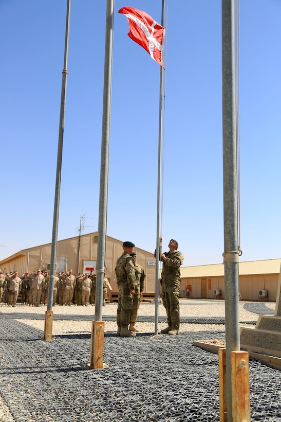 Danish soldiers, part of the Danish Contingent International Security Assistance Force 17 (DANCON
ISAF-17), participate in the Flag Lowering Ceremony aboard Camp Leatherneck, Helmand province, Afghanistan, July 21, 2014. The lowering of the Danish flag over Camp Leatherneck formally concludes the county's participation in RC(SW).
(Official U. S. Marine Corps photo by Sgt. Dustin D. March/Released)