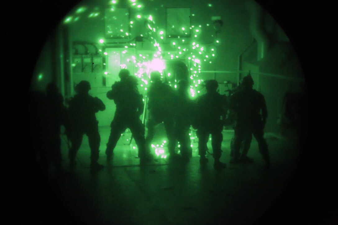 Marines with the 24th Marine Expeditionary Unit’s Maritime Raid Force cut through a door during a nighttime Visit, Board, Search and Seizure exercise at Joint Base Langley-Eustis, Virginia, July 17, 2014. The exercise was part of Realistic Urban Training, the 24th MEU’s first major pre-deployment training exercise in preparation for their upcoming deployment. The MRF is a contingent of Marines from Force Reconnaissance Company, 2nd Reconnaissance Battalion.
