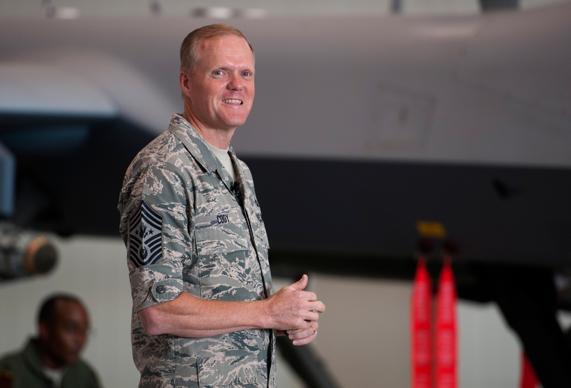 Chief Master Sgt. of the Air Force James Cody delivers his enlisted perspective to the Airmen of the 432nd Wing/432nd Air Expeditionary Wing and 799th Air Base Group during an all-call at Creech Air Force Base, Nev., July 16, 2014. During his visit, Cody saw firsthand the operations tempo of the base’s Airmen.  Everyday Creech Airmen fulfill their mission by providing intelligence, reconnaissance and surveillance, maintenance, base support and defense, and other capabilities in support of combatant commanders around the globe..  (U.S. Air Force photo by Tech. Sgt. Nadine Barclay/RELEASED)