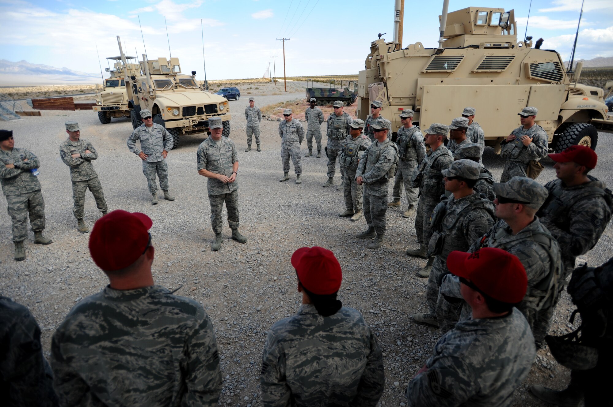 Chief Master Sgt. of the Air Force James Cody discusses the importance Airmen of the 799th Security Forces Squadron and 99th Ground Combat Training Squadron play in remotely piloted aircraft operations at Creech Air Force Base, Nev., July 16, 2014. During his visit, Cody saw firsthand the operations tempo of the base’s Airmen.  Everyday Creech Airmen fulfill their mission by providing intelligence, surveillance and reconnaissance, maintenance, base support and defense, and other capabilities in support of combatant commanders around the globe. (U.S. Air Force photo by Tech. Sgt. Nadine Barclay/RELEASED)