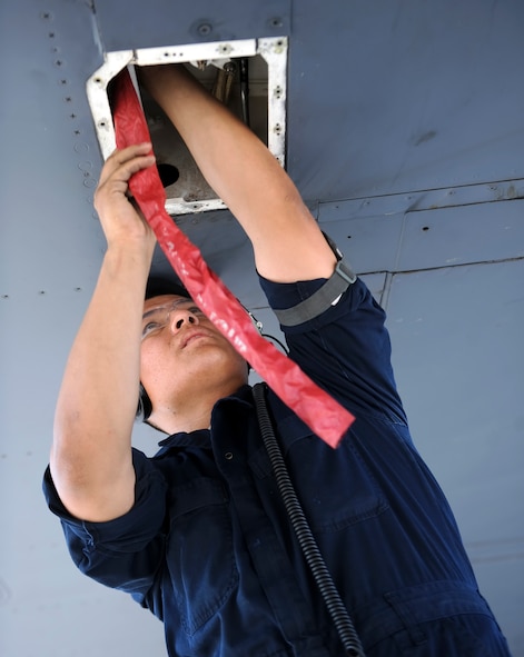 U.S. Air Force Senior Airman Luis Gonzalez, 7th Aircraft Maintenance Squadron hydraulics journeyman, adjusts the left flap asymmetry brake sensor (ABS) on a B-1B Lancer July 15, 2014, at Dyess Air Force Base, Texas. The maintenance section trains on repair operations often so they are prepared in the event of an actual malfunction. (U.S. Air Force photo by Airman 1st Class Kedesha Pennant/Released)