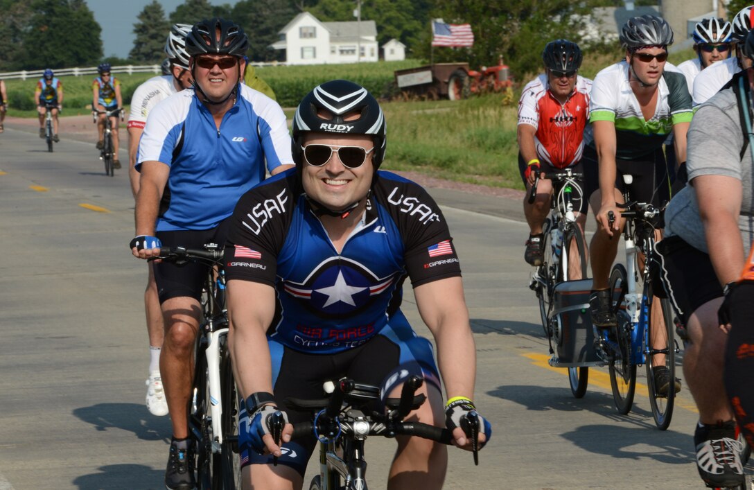 A member of the Air Force Cycling Team is all smiles as he makes his way down the highway during The Registers Annual Great Bike Ride Across Iowa or RAGBRAI on July 20,2014. The weeklong event will take riders across the state in seven days.
U.S. Air Guard Photo by Master Sgt. Vincent De Groot/ released