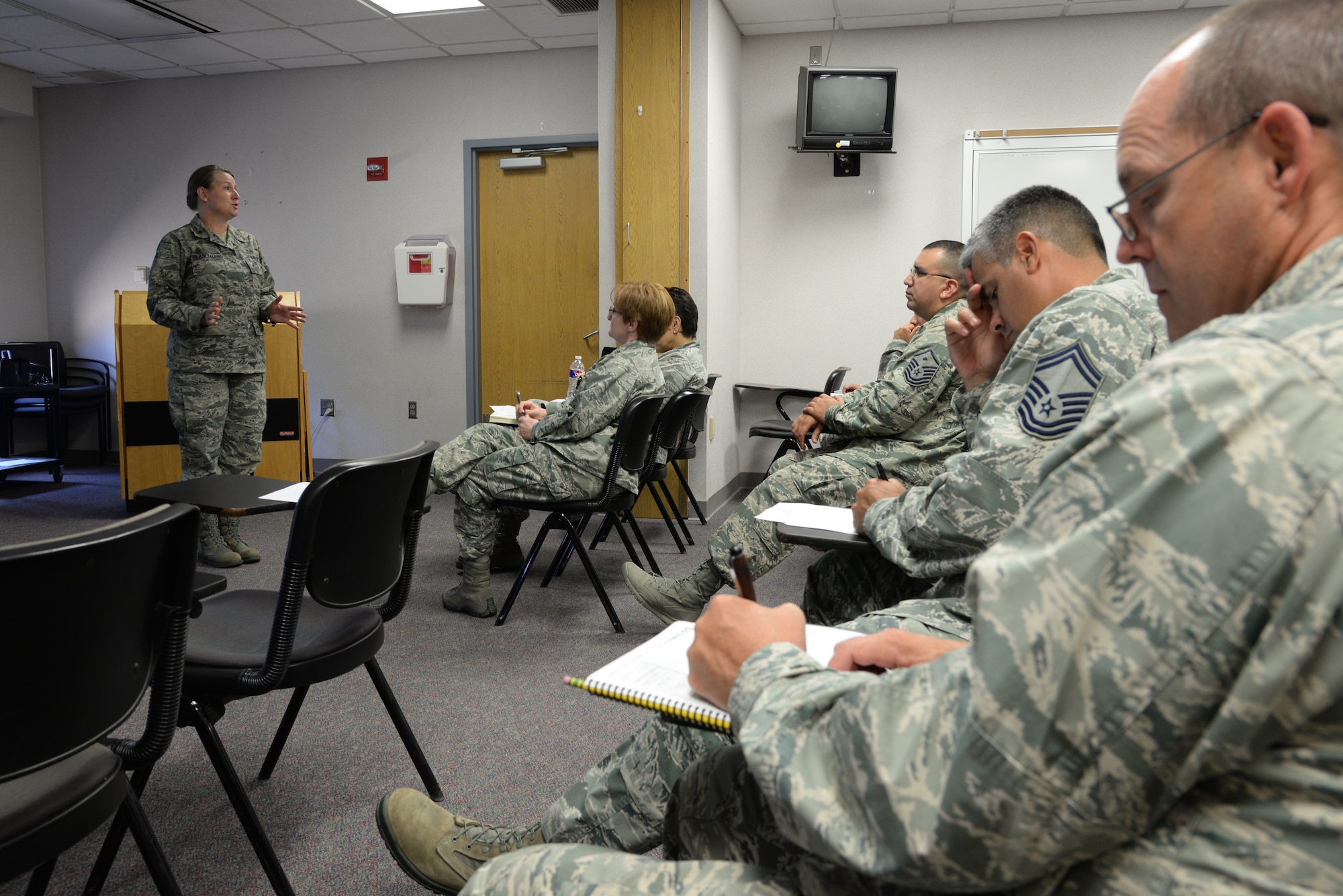 Maj. Janet Blanchard, the 59th Medical Wing’s chief of Business Innovation, briefs flight commanders and chiefs from the 59th MDW at the Wilford Hall Ambulatory Surgical Center, Joint Base San Antonio-Lackland, Texas, July 10, 2014. Blanchard, focused on leading innovative change within the work centers. The series of briefings she provides follows the Golden Circle model developed by Simon Sinek, which teaches about why an organization does what it does. (U.S. Air Force photo/Staff Sgt. Christopher Carwile)