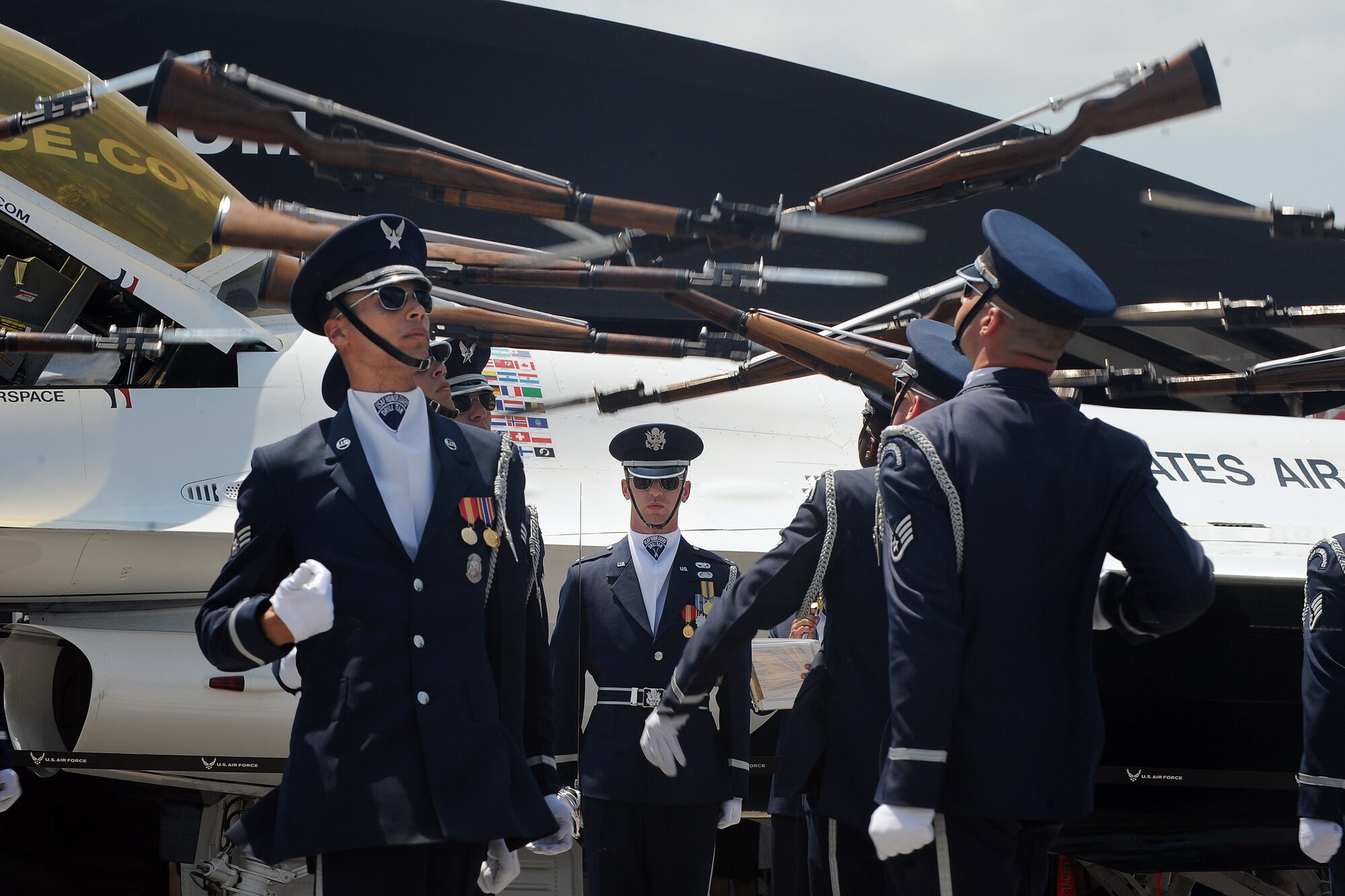 The United States Air Force Honor Guard draws crowds as they begin their exhibition at the 2014 Defenders of Freedom Open House and Air Show July 20 at Offutt Air Force Base, Neb.  The Drill Team promotes the Air Force mission by showcasing drill performances at public and military venues to recruit, retain, and inspire Airmen. (U.S. Air Force photo by Josh Plueger/Released)