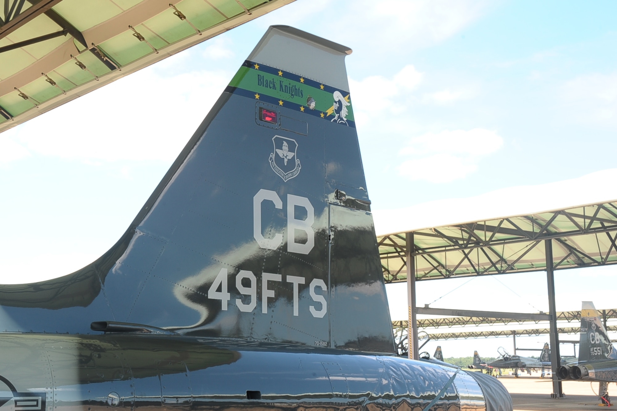 The 49th Fighter Training Squadron’s T-38 Talon aircraft rests on the flightline displaying the squadron’s black knight at Columbus Air Force Base, Miss., July 17. In addition to training pilots they also train combat weapon systems officers. Those selected learn basic fighter maneuvers and surface attacks in the T-38 at Introduction to Fighter Fundamentals which lasts approximately eight weeks. (U.S. Air Force photo/ Senior Airman Kaleb Snay)