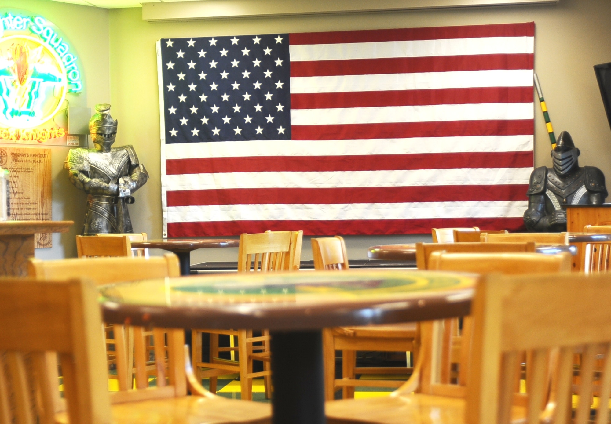 The Black knights guard the U.S. flag inside the 49th Fighter Training Squadron’s heritage room at Columbus Air Force Base, Miss., July 17. Although the 49 FTS molds fresh pilots into fighter pilots today, the squadron has gone through many changes throughout the years before becoming a training squadron. (U.S. Air Force photo/ Senior Airman Kaleb Snay)