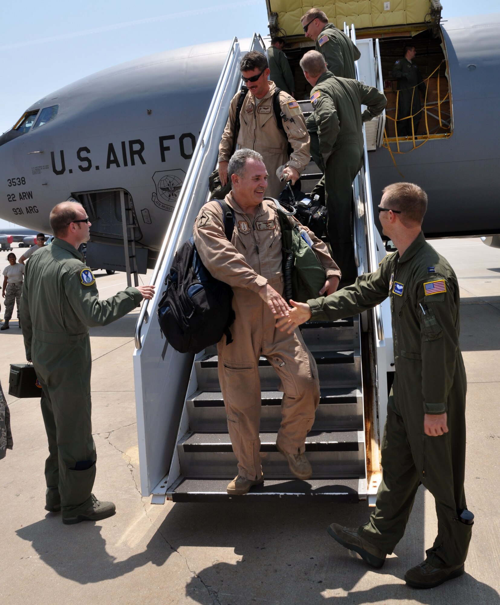 Members of the Air Force Reserve 931st Air Refueling Group are welcomed home to McConnell Air Force Base, Kan., July 21, 2014.  The Citizen Airmen had served a 60-day deployment to Al Udeid Air Base, Qatar, as part of the 379th Air Expeditionary Wing.  (U.S. Air Force photo by Capt. Zach Anderson)      