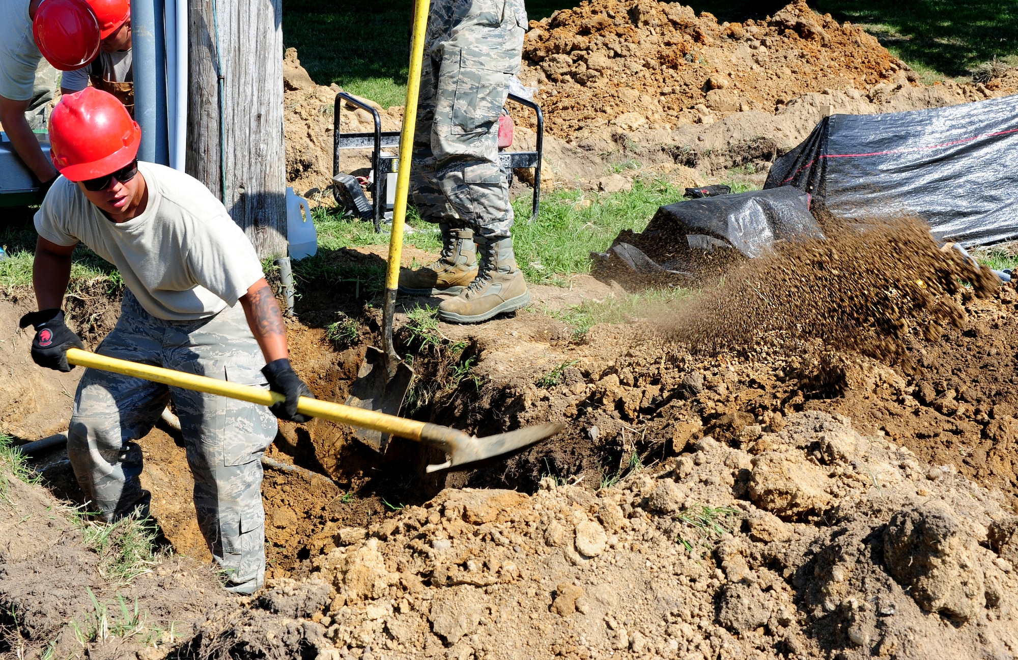 U.S. Air Force Senior Airman Mark School, 820th Rapid Engineer Deployable Heavy Operational Repair Squadron Engineer electrician from Nellis Air Force Base, Nev., locates buried electrical lines at Langley Air Force Base, Va., July 18, 2014. REDHORSE squadrons provide heavy-repair capability and construction support when requirements exceed normal base civil engineer squadron capabilities. (U.S. Air Force photo by Airman 1st Class Areca T. Wilson/Released) 