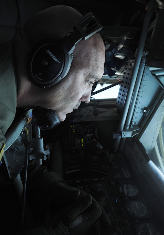Tech. Sgt. Chris McAlister operates refueling boom while in flight over Virginia July 18, 2014. McAlister is an air refueling technician and has been with the 756th Airlift Squadron for over 23 years. (U.S. Air Force photo/ Senior Airman Nesha Humes)                                                                         