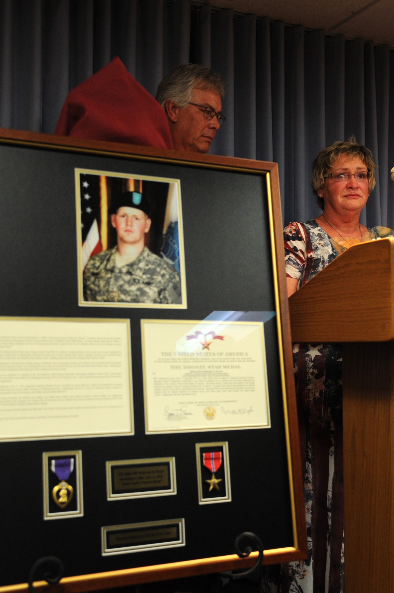 Sherry Wyatt expresses her gratitude to the attendees of the dedication ceremony at the St. Louis Military Entrance Processing Station in St. Louis, MO, July 17, 2014. Twelve soon to be service members were sworn in to christen the room. (U.S. Air Force photo/Senior Airman Tristin English)