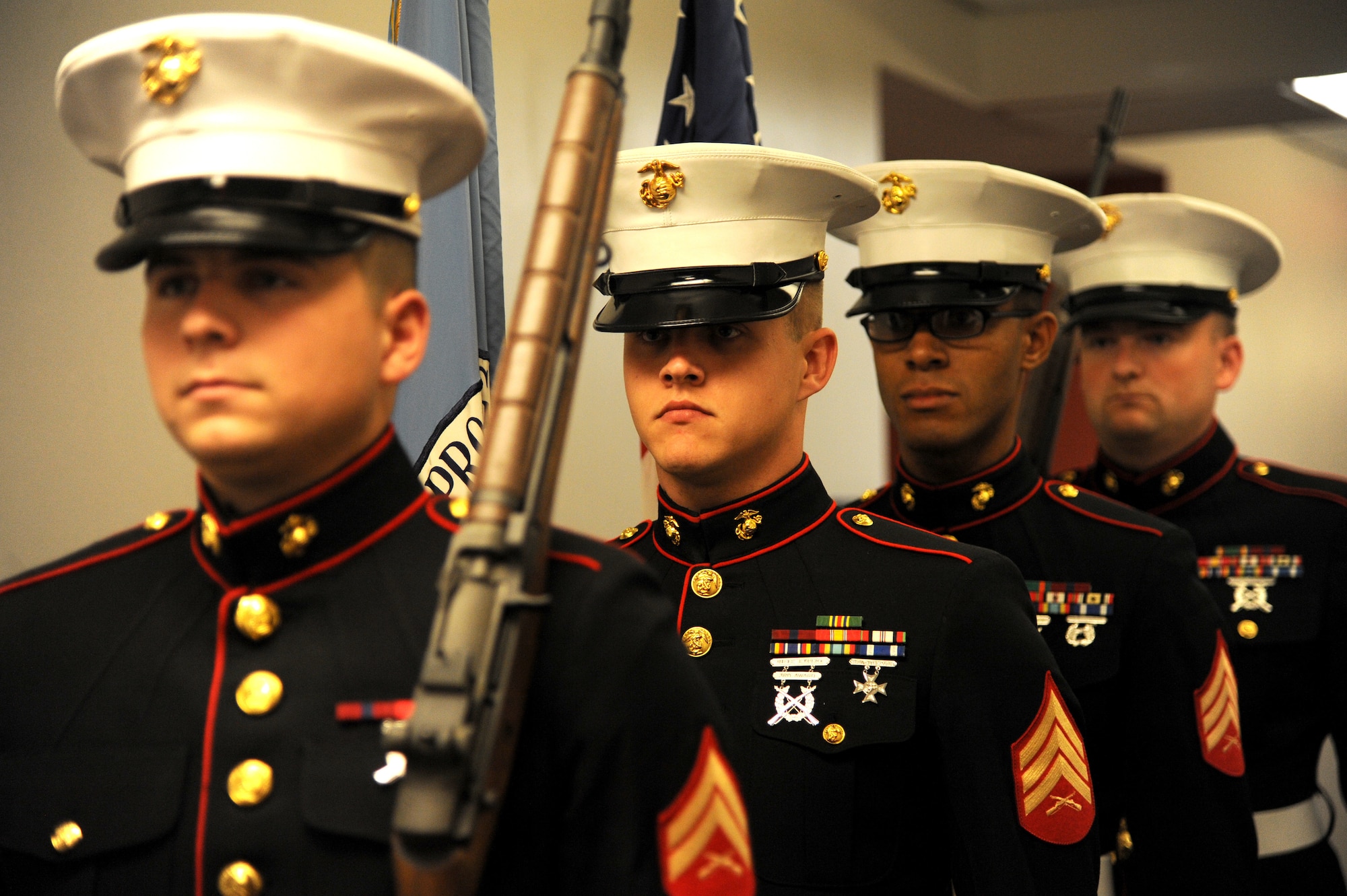Members of a Marine Honor Guard detail post the colors at the  U.S Army Specialist Sterling Wyatt dedication ceremony at the St. Louis Military Entrance Processing Station in St. Louis, MO, July 17, 2014. Sterling Wyatt was killed in action when his vehicle was attacked with an enemy improvised explosive device. Wyatt received the Medal of Valor,Combat Infantry Badge and the Bronze Star. (U.S. Air Force photo/Senior Airman Tristin English)