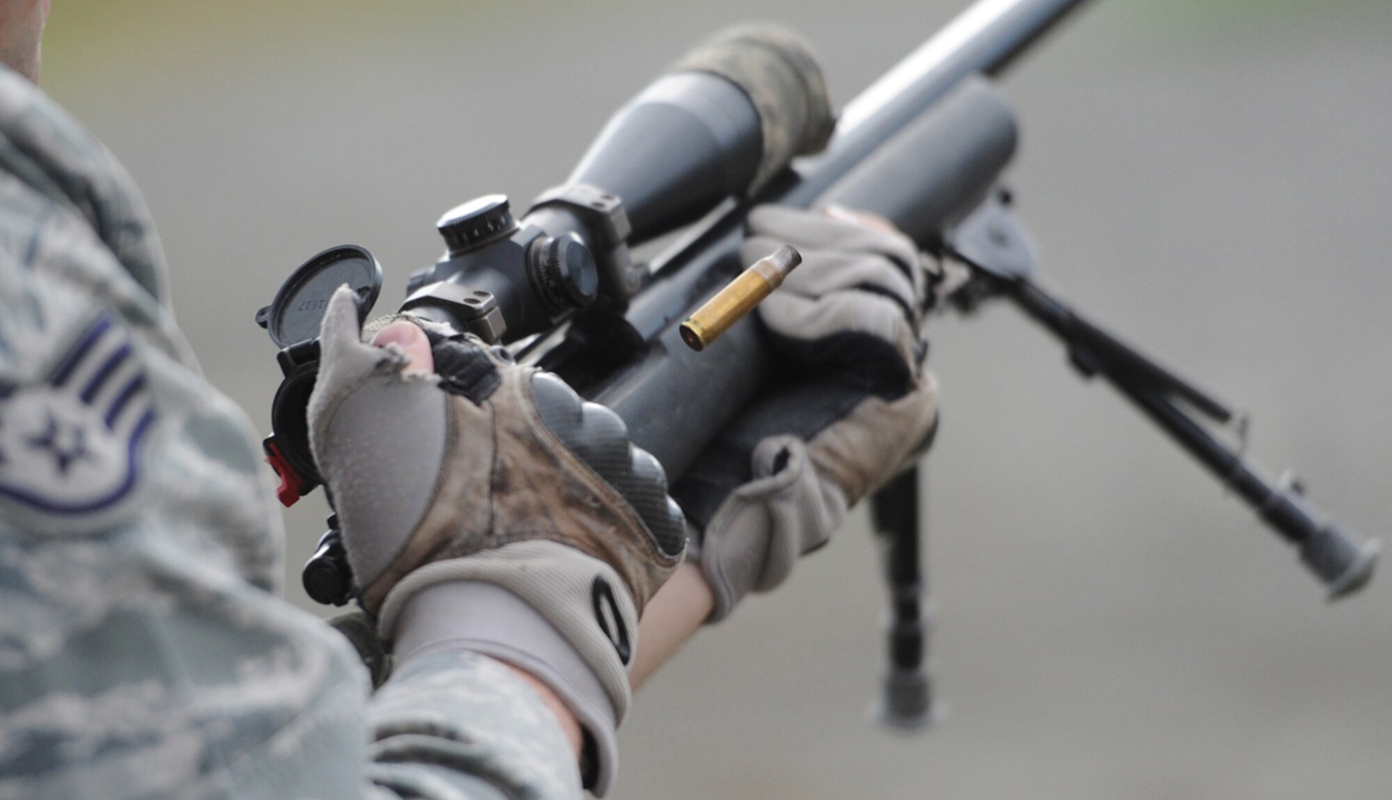 Air Force Staff Sgt. Ryan Link, a native of West Branch, Mich., assigned to the 673d Security Forces Squadron, ejects an expended casing from his weapon while training with the M24 Sniper Weapon System on Joint Base Elmendorf-Richardson, Friday, July 11, 2014.  The M24 is a military version of the Remington Model 700 7.62mm rifle, and has been in service with the U.S military since 1988. (U.S. Air Force photo/Justin Connaher)
