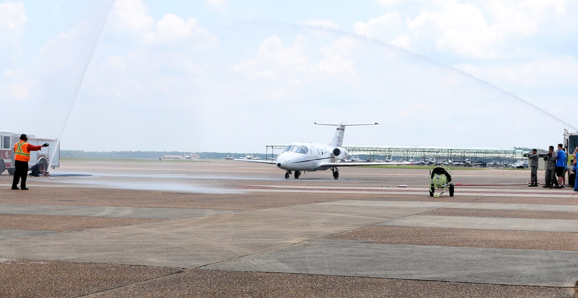 Col. Brett Pennington, 14th Operations Group Commander, taxis in from his fini-flight in his military aviation career July 14, 2014, at Columbus Air Force Base, Miss. A fini-flight is the final flight that an Airman takes before he or she leaves the squadron, group or wing they are assigned to. (U.S. Air Force photo/ Elizabeth Owens)