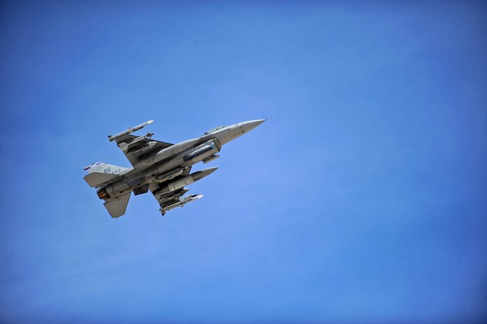 An F-16 Fighting Falcon assigned to the 31st Wing, Aviano Air Base, Italy, flies during Red Flag 14-3 at Nellis Air Force Base, Nev., July 15, 2014. Throughout the exercise, aircraft from more than 16 different U.S. Air Force squadrons will share the skies with aircraft from the French and Singapore air forces. (U.S. Air Force photo by Staff Sgt. Siuta B. Ika)
