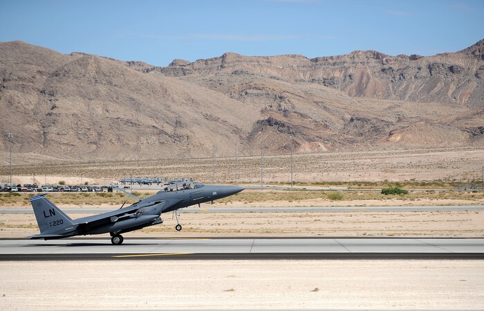An F-15E Strike Eagle assigned to the 48th Fighter Wing, Royal Air Force Lakenheath, England, lands during Red Flag 14-3 at Nellis Air Force Base, Nev., July 15, 2014. Red Flag exercises involve a variety of attack, fighter, bomber, reconnaissance, electronic warfare aircraft, air superiority aircraft, airlift support, search and rescue aircraft, and aerial refueling aircraft. (U.S. Air Force photo by Staff Sgt. Siuta B. Ika)