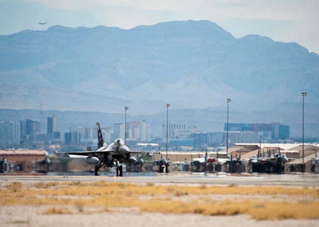 An F-16C Fighting Falcon from the 64th Aggressor Squadron lands after a training mission during Red Flag 14-3, July 15, 2014, at Nellis Air Force Base, Nev. Red Flag provides a series of realistic air-to-air combat training missions designed to increase combat readiness and effectiveness. (U.S. Air Force photo by Airman 1st Class Thomas Spangler)