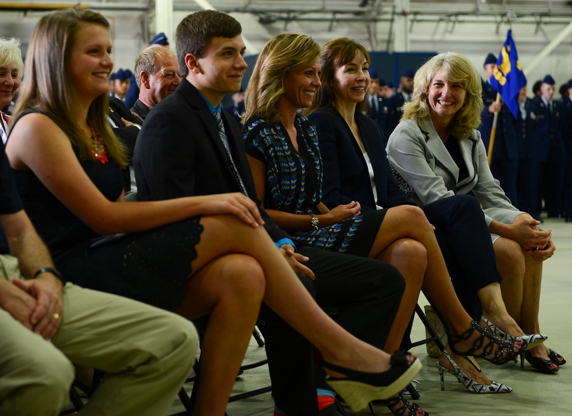 Families of the outgoing and incoming 48th Fighter Wing commanders are recognized during a change of command ceremony in Hangar 7 at Royal Air Force Lakenheath, England, July 21, 2014. (U.S. Air Force photo by Airman 1st Class Dawn M. Weber/Released)
