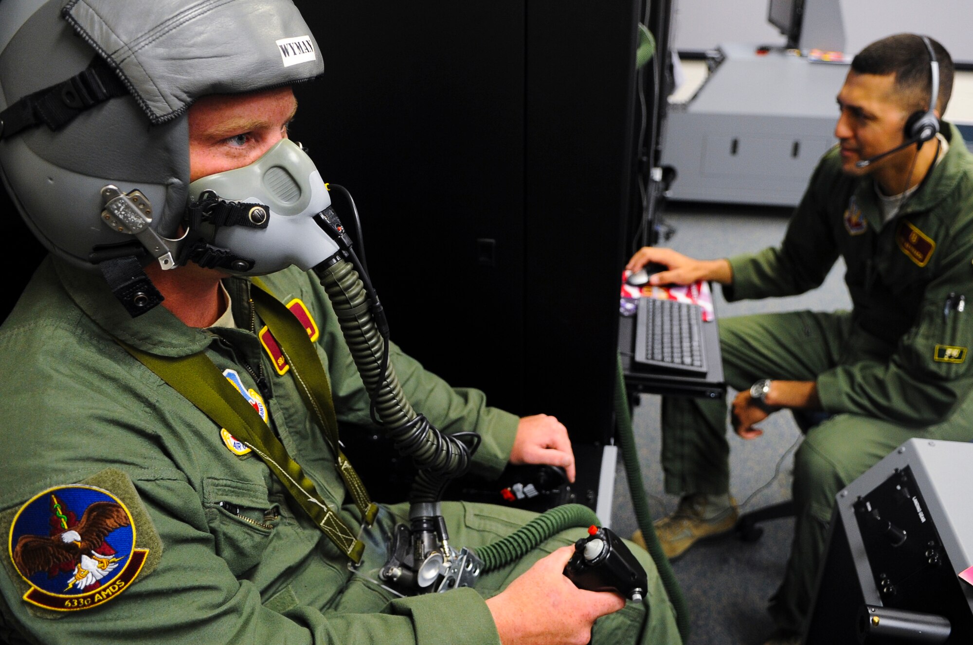U.S. Air Force Senior Airman Mason Wyman, 633rd Aerospace Medical Squadron aerospace physiology technician, tests the Reduced Oxygen Breathing Device at Langley Air Force Base, Va., June 25, 2014. The ROBD allows 633rd AMDS personnel to discreetly reduce airflow for more realistic training on hypoxia awareness for pilots. (U.S. Air Force photo by Senior Airman Austin Harvill/Released)
