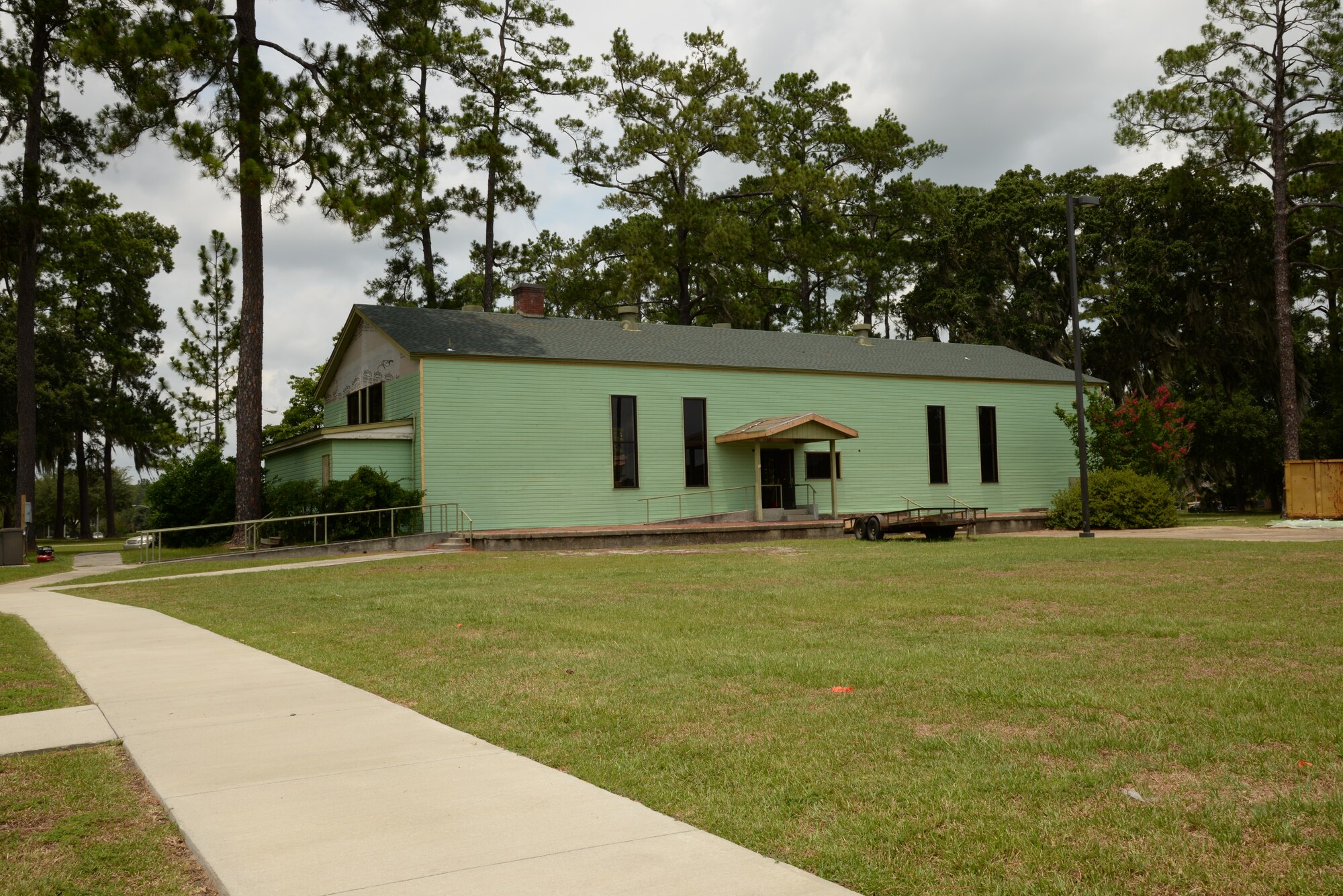 The rear entrance to the heritage building is undergoing renovation and will provide patrons visiting the facility access to the President George W. Bush Air Park at Moody Field, at Moody Air Force Base, Ga., July 16, 2014. The building is being restored and painted green to give it a look similar to its original design when built in 1942. (U.S. Air Force photo by Staff Sgt. Eric Summers Jr./Released)