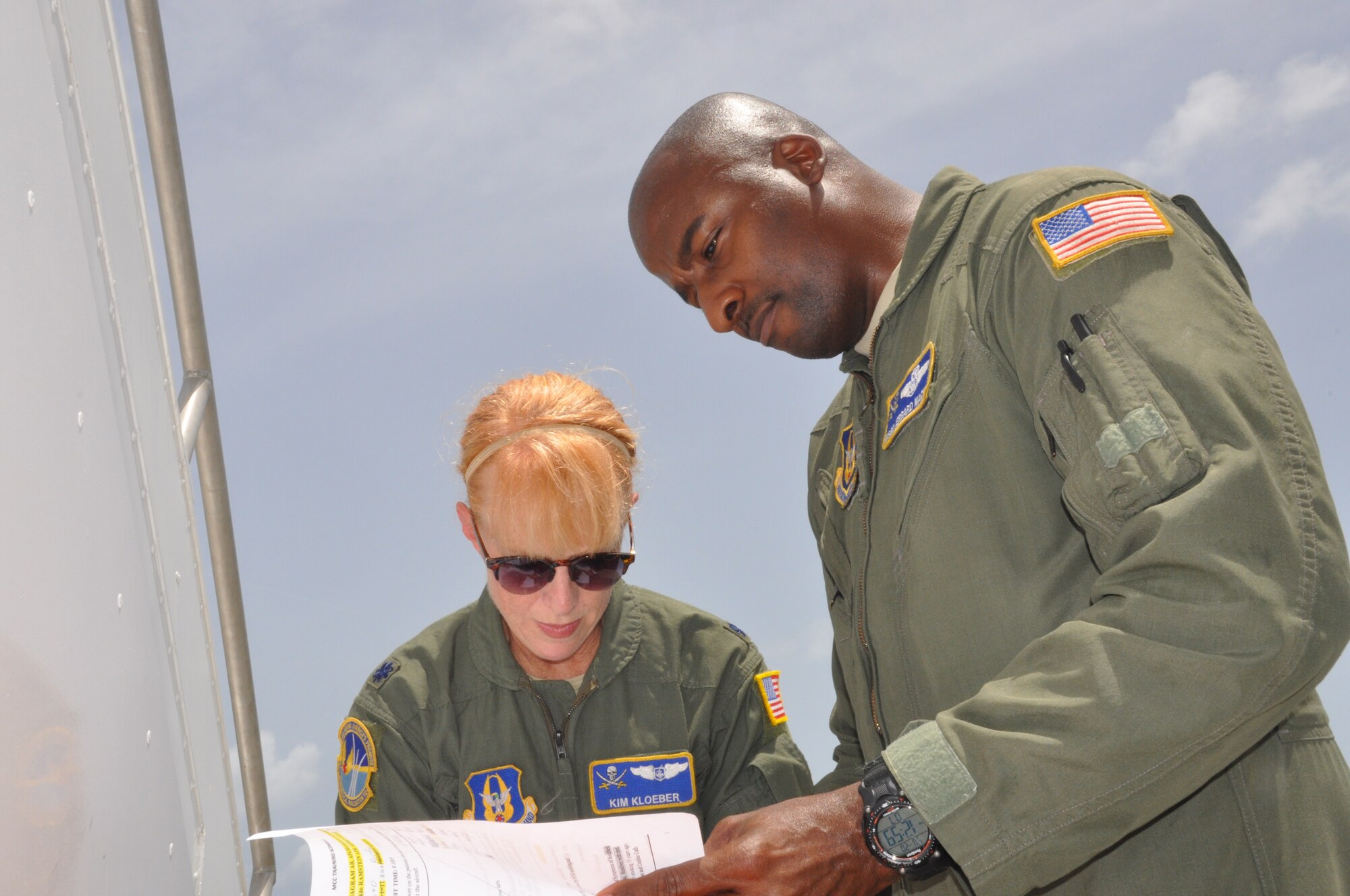 Lt. Col. Kim Kloeber and MSgt Jerrard Mack review a patient’s information prior to a medical training scenario, July 20th. Members of the 45th AES completed multiple training scenarios during the three-day mission required quarterly to be certified on a KC-135 Stratotanker. (U.S. Air Force photo by SrA Adam Borgman)